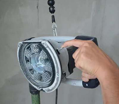 hiomakone ripustimessa