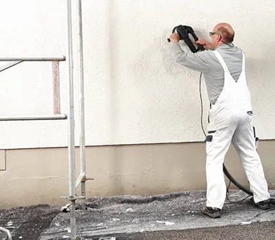 talon seinän hiominen